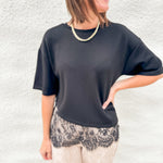 Black scuba tee shirt with lace hem asymmetric hem detail, fawn print barrel pants