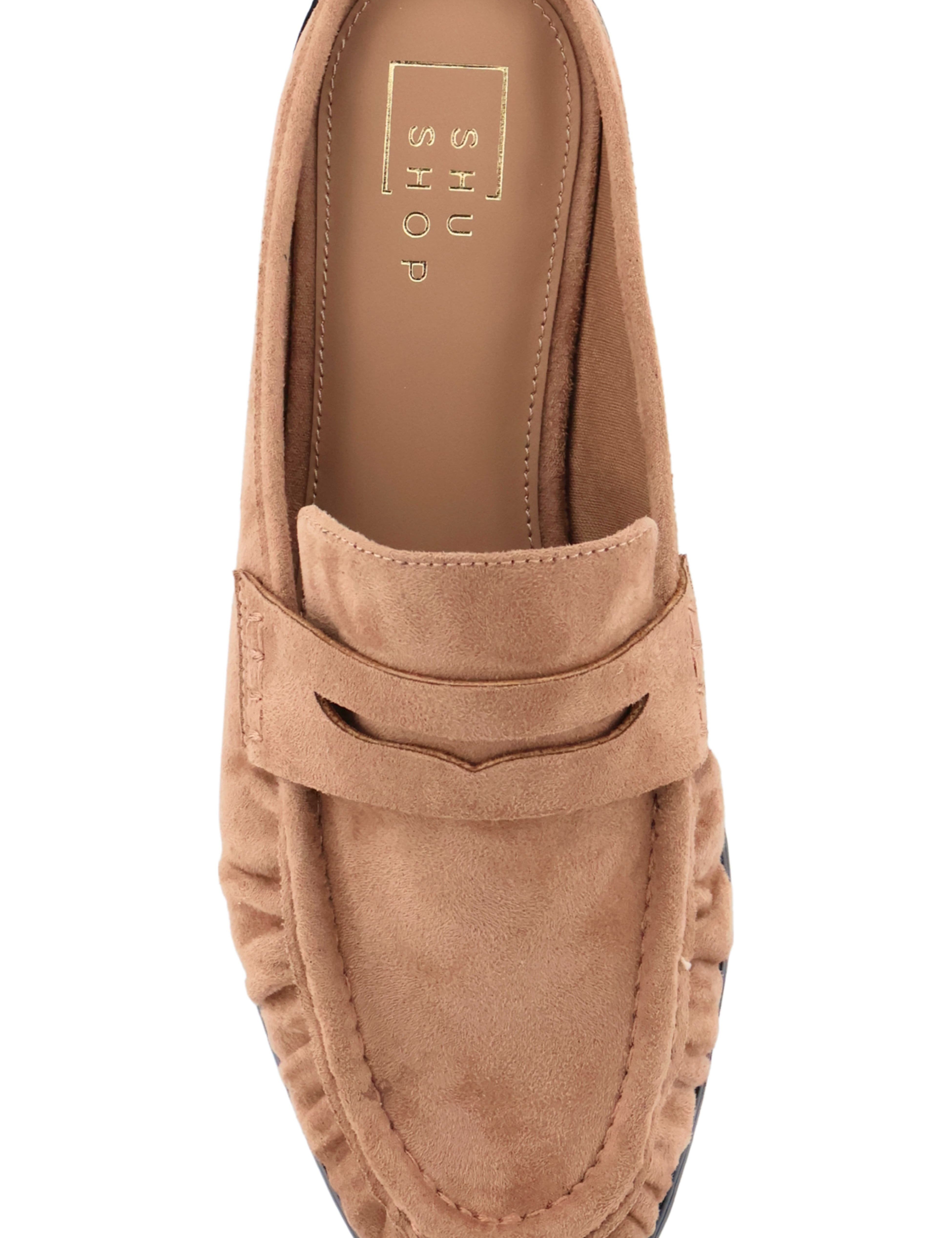 A single tan suede penny loafer mule shown from a top-down view on a white background. The brand name 'SHOES BY SHARMA' is visible on the insole.