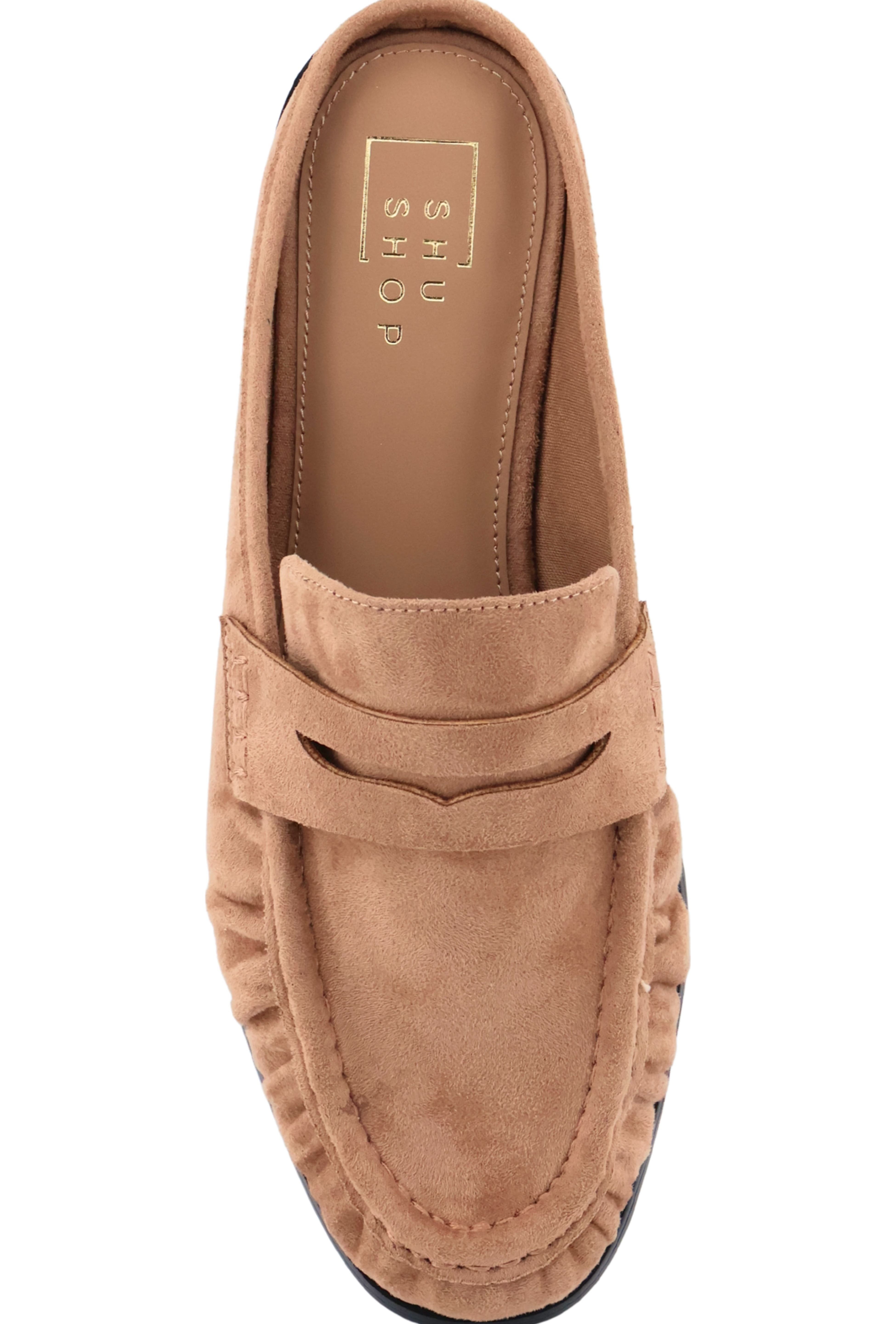 A single tan suede penny loafer mule shown from a top-down view on a white background. The brand name 'SHOES BY SHARMA' is visible on the insole.