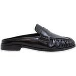 A single black leather mule loafer with a low block heel, shown in a side profile view against a plain white background.